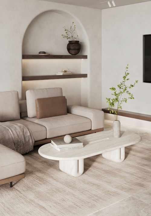 A modern living room with a sectional sofa, coffee table, wall shelves with decor, and a potted plant, all in neutral tones.